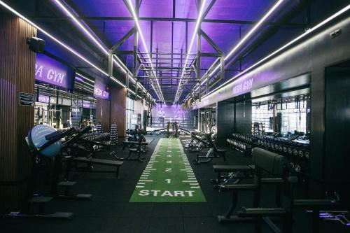a gym with rows of chairs and a train at ibis Styles Batumi Hotel in Batumi