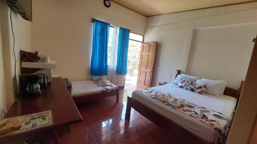 En eller flere senge i et værelse på Aloha Surf Nosara - Kahala Hui Cabins #4