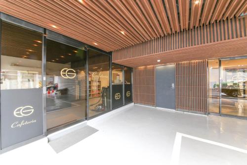 a store front with glass windows and a wooden ceiling at EGSTAY HOTEl in Gwangju
