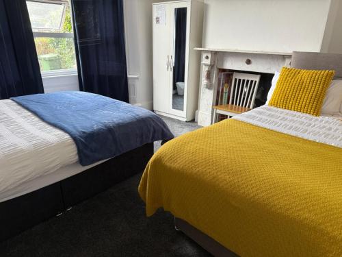 a bedroom with a bed and a fire place at Family Room 1 in Avonmouth