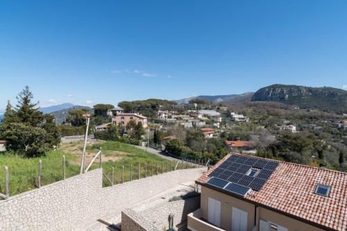a house with solar panels on the roof at Villa La Meraviglia - Between Sorrento & Amalfi Coast in Colli di Fontanelle