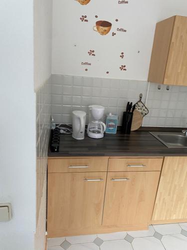 a kitchen with a counter top and a sink at Alida 2 in Helmstedt