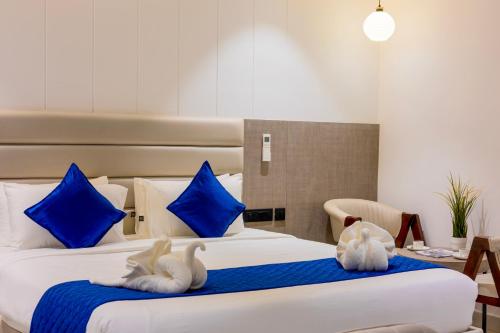 Letto o letti in una camera di La Maniere -Business hotel HITECH City