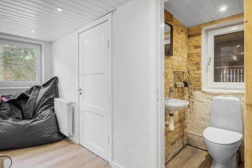 a bathroom with a toilet and a sink at OH512-Hadsund-Fiskerihavnsvej-7 in Hadsund