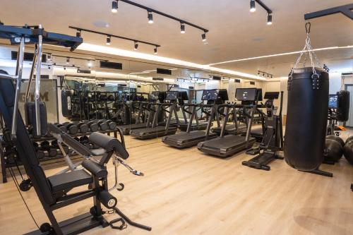 a gym with a lot of exercise equipment at Saint Nicolas Hotel in Himare