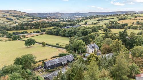 an aerial view of a house in a field at Dam View Shepherds Hut in Rhayader
