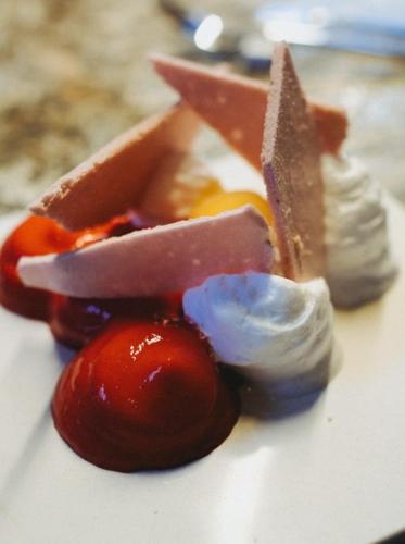 a plate of food with fruit and sauce on it at S'Hotelet d'es Born - Suites & SPA in Ciutadella