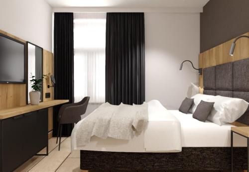 Giường trong phòng chung tại Galleria Central Apartments & Wellness
