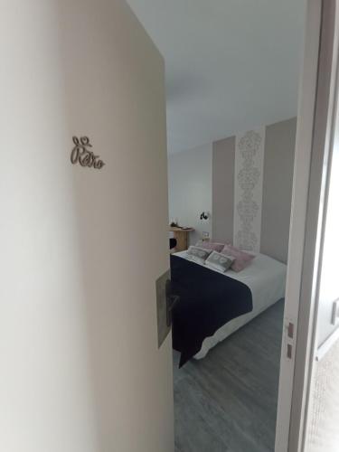 Cama o camas de una habitación en Chambres et Tables d'hotes " O Doux Matins " aux portes de Chinon
