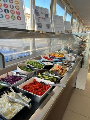 a buffet line with many different types of food at Planos Beach Hotel in Tsilivi