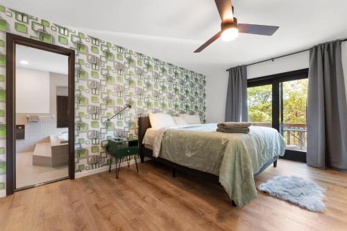 a bedroom with a bed and a large mirror at Spacious Waterfront Mansion wHot tubPoolTable in East Stroudsburg