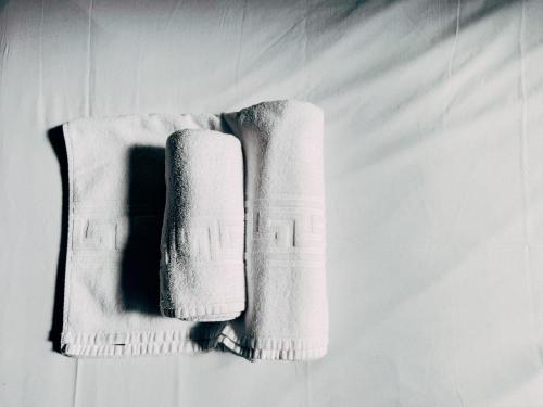 a pair of towels hanging on a wall at MadVibes Hostel Gran Vía in Madrid