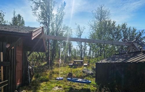 a backyard with a gazebo and a table with boats at 3 Bedroom Lovely Home In Dagali in Dagali