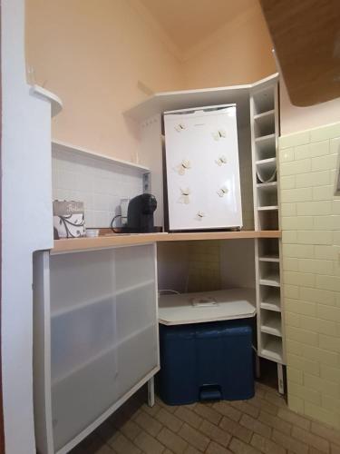 a small kitchen with a sink and a shelf at house Cicognola offers comfort and convenience between Lake Maggiore, Malpensa Airport, Novara, Varese and Milan in Castelletto sopra Ticino
