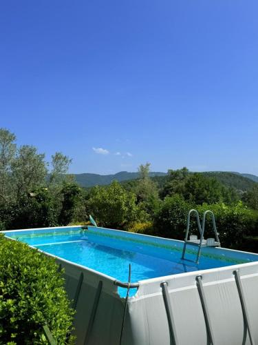 a swimming pool on the side of a house at Casa Petra in Morillo de Monclús