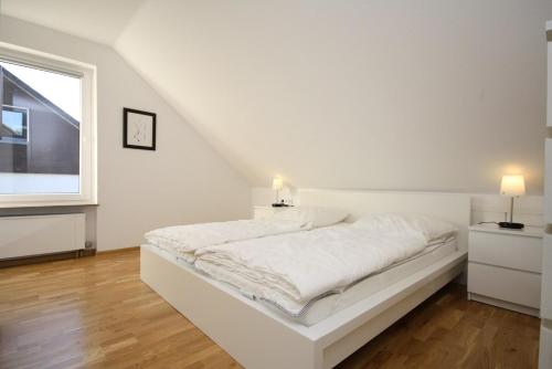 Ένα ή περισσότερα κρεβάτια σε δωμάτιο στο Ferienhaus Jennie