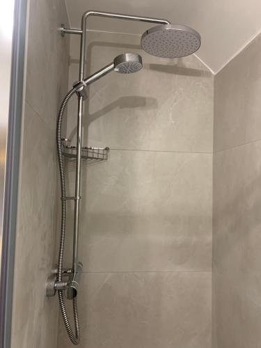 a shower with a shower head in a bathroom at Cappagmore in Portstewart