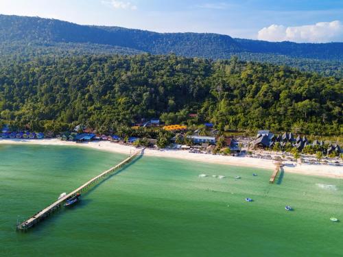 an aerial view of a beach with a pier at Koh Rong New Beach in Kaôh Rŭng