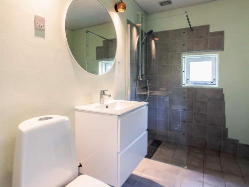a bathroom with a sink and a mirror at Middelfart Holiday Center in Middelfart