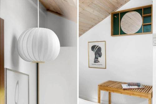a white room with a table and a lamp at 6619-Allinge-Markvejen-45 in Allinge