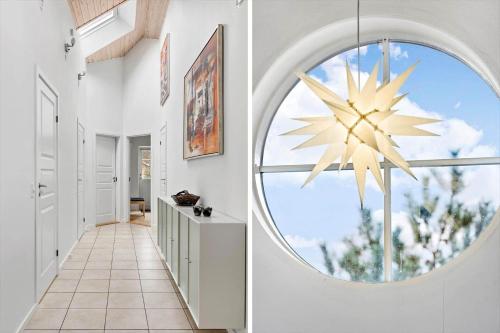a hallway with a large window in a house at 3709-Nexo-Pynten-3 in Neksø