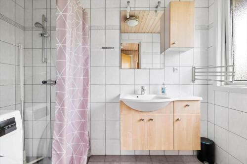 a bathroom with a sink and a shower at 6683-Allinge-Brunekulvej-2-D in Allinge