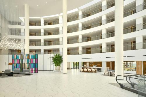 a rendering of a building with a courtyard at Courtyard by Marriott Pyeongtaek in Pyeongtaek