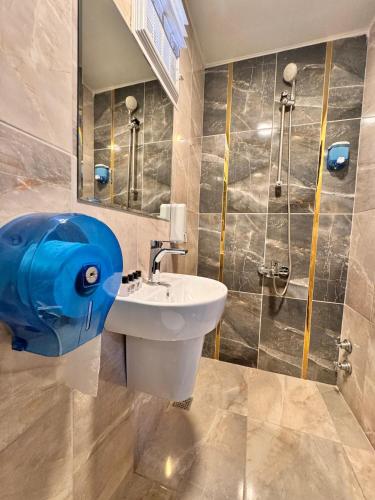a bathroom with a sink and a shower at TAN OTEL in Mersin