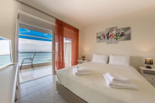 Ένα ή περισσότερα κρεβάτια σε δωμάτιο στο Kiveri Apartments