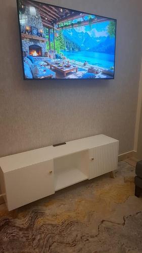Regina Homesにあるテレビまたはエンターテインメントセンター