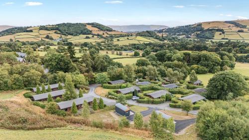 an aerial view of a farm with trees and buildings at Sunny View in Rhayader