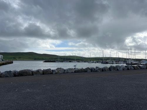 a large body of water with boats in it at 2 Cois Chnoic - Dingle holiday home in Dingle