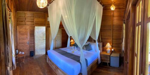 Ένα ή περισσότερα κρεβάτια σε δωμάτιο στο Villas Ume Sedani