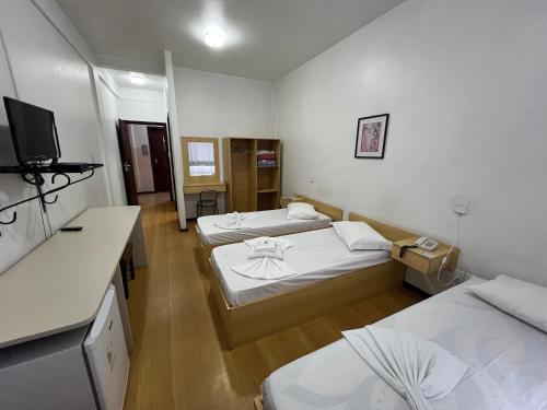 Postel nebo postele na pokoji v ubytování Hotel St. John