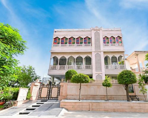 a building with a staircase in front of it at Harnawa Haveli - A Boutique Heritage Stay in Jaipur