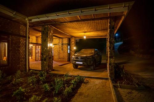 a car parked inside of a garage at night at Burunga Gorilla Lodge in Kisoro
