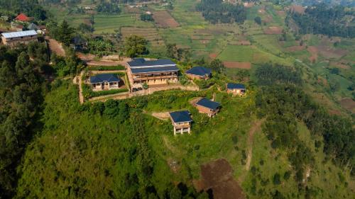 an aerial view of a house on a hill at Burunga Gorilla Lodge in Kisoro