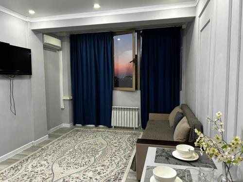 Televisyen dan/atau pusat hiburan di Ush Sunkar apartment корпус 6