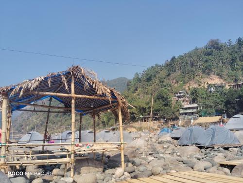 a group of tents on a pile of rocks at Meban camping shnongpdeng in Dawki