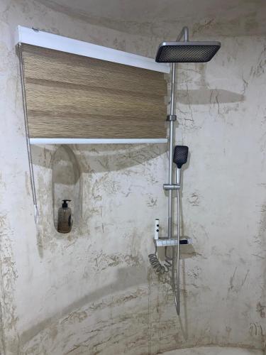 a shower in a bathroom with a shower curtain at Oasis beach resort in Cape Coast