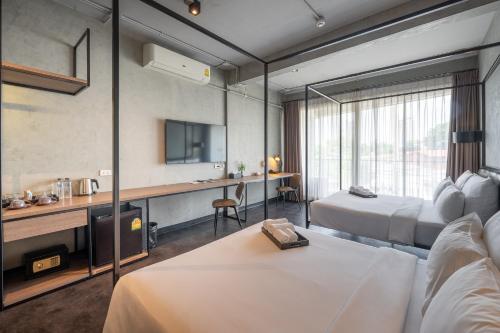 Кровать или кровати в номере The Ex Capital Hotel Bangkok by Dancenter