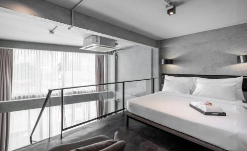 Кровать или кровати в номере The Ex Capital Hotel Bangkok by Dancenter