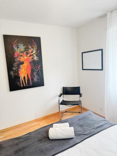 Postel nebo postele na pokoji v ubytování BASELiving apartment with PRIVATE GARDEN