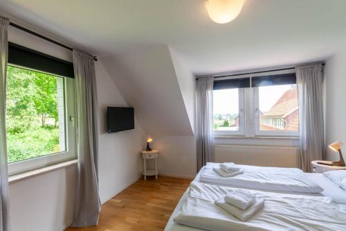 Ένα ή περισσότερα κρεβάτια σε δωμάτιο στο Ferienhaus Lars