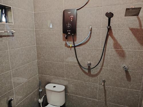 Ένα μπάνιο στο Roomstay Kak Ton