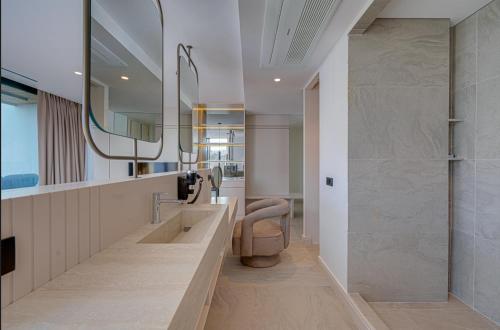 a bathroom with a sink and a mirror at VENTO MARE LUXURY Hotel in Cesme
