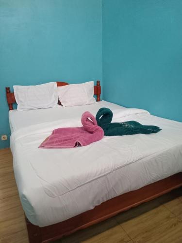 Ένα ή περισσότερα κρεβάτια σε δωμάτιο στο Glampar Homestay