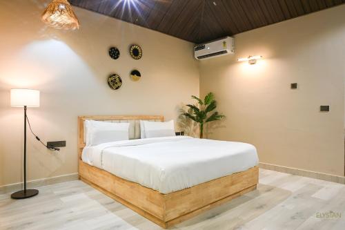 a bedroom with a large bed in a room at The Elysian Boutique Stays - Havelock in Havelock Island
