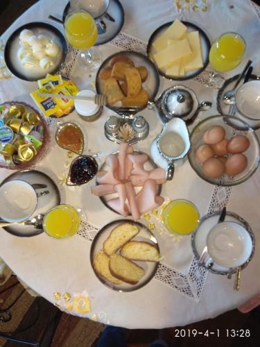 a table with eggs and food on a table at Eleni Country Cottage 2 in Feneos