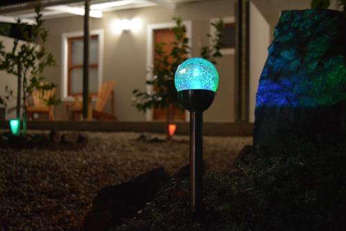 a blue light on a pole in a yard at Travellers Rest in Prince Albert